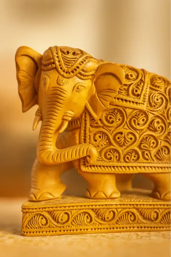 image of wooden elephant idol in kadam wood by kaarigar handicraft made by skilled artisans or karigar